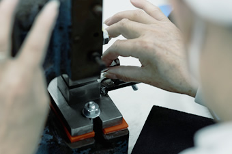 Hands of craftsmen who make brushes